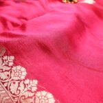 Blessed beginnings wrapped in the warmth of royal pink.
Where sacred motifs meet the elegance of pure Banarasi gold.