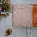 A delicate blend of pastel blush tones and a vibrant orange border, beautifully woven with subtle metallic threads.
Perfectly paired with festive accents to bring a touch of timeless grace to your wardrobe.